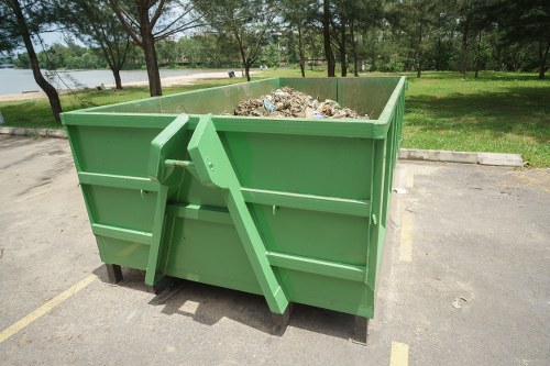 Workers sorting demolition materials for recycling